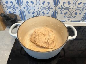 Mixing the homemade play-dough ingredients in a pot